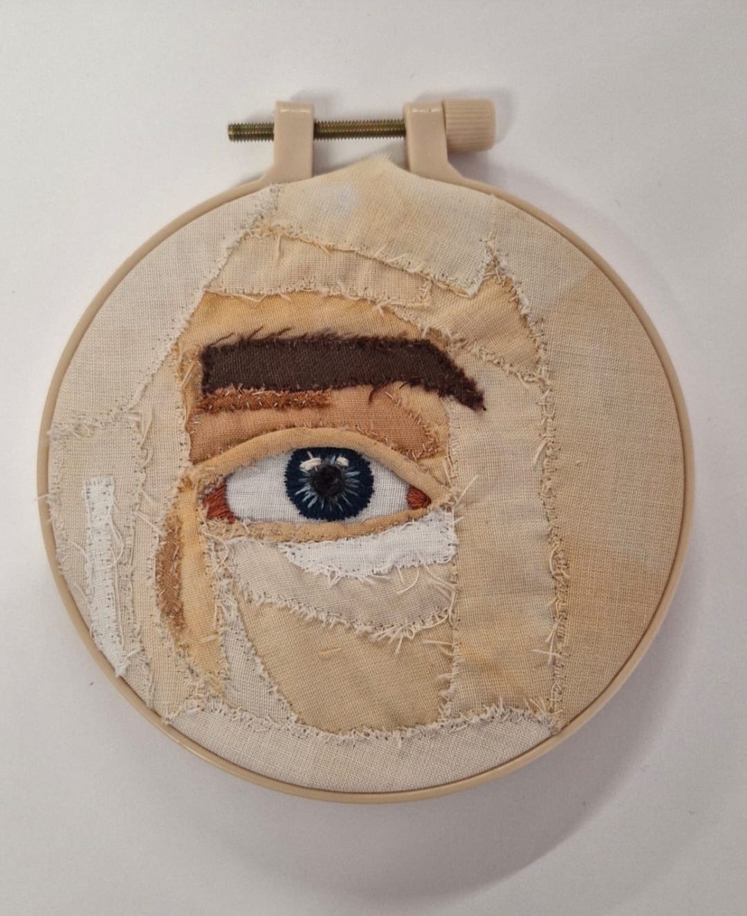 An embroidery of an eye in close up