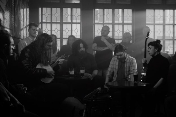 Image of a scene from the Documentary Film North Circular featuring 4 musicians in a crowded pub