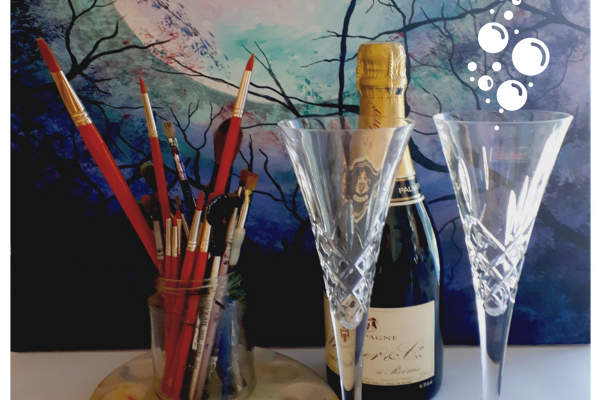 Image of jar of paintrushes next to mini prosecco bottles