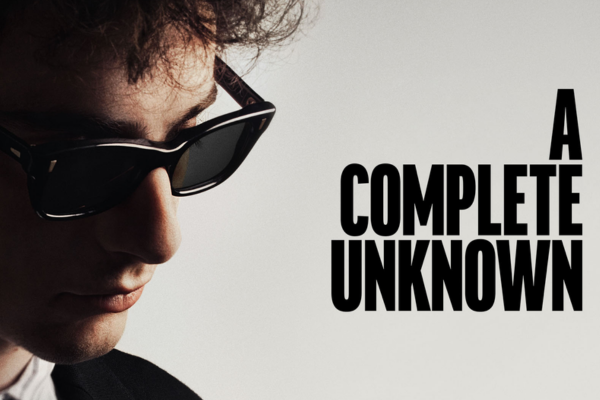 Close up of actor timothy chalamet playing bob dylan in fil a complete unknown