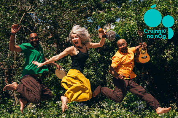 Ta tum tum image of 3 musicians with their instruments jumping into the air
