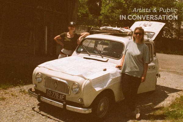 2 women stand beside an old renault car preparing for a road trip