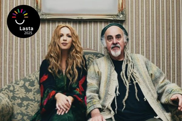Lisa Lambe and steve cooney sit on a couch